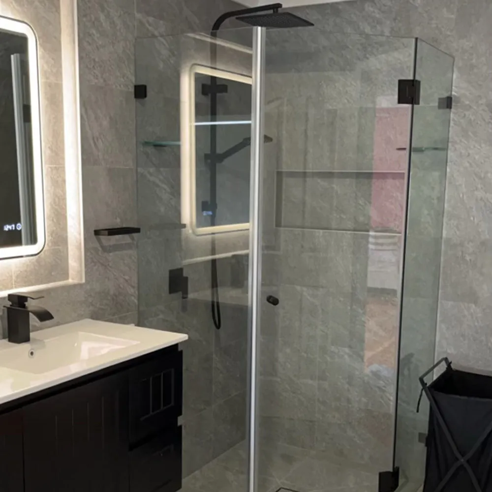 modern bathroom design and renovation Frameless glass shower beside a dark vanity with a backlit mirror